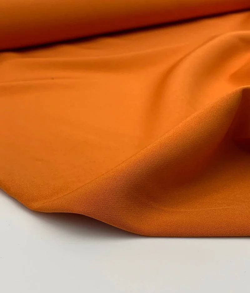 Tissu Bi-stretch Milano orange poussiéreux